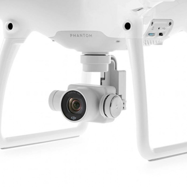 Квадрокоптер DJI Phantom 4 + 2 доп. аккумулятора + авто З/У